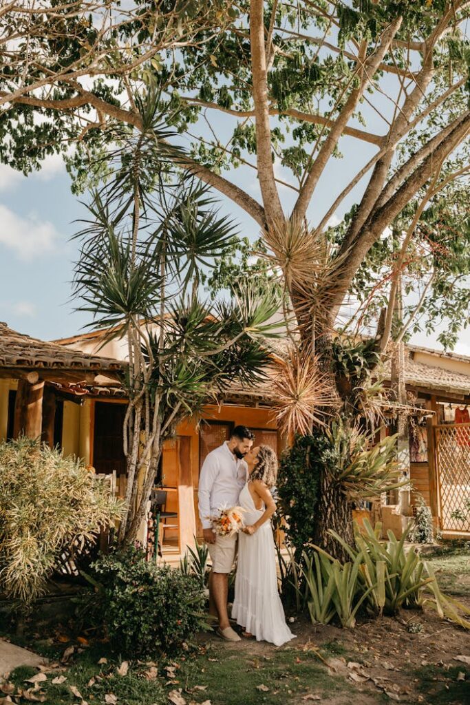 pexels-photo-11643561 Newlyweds Kissing under a Tree