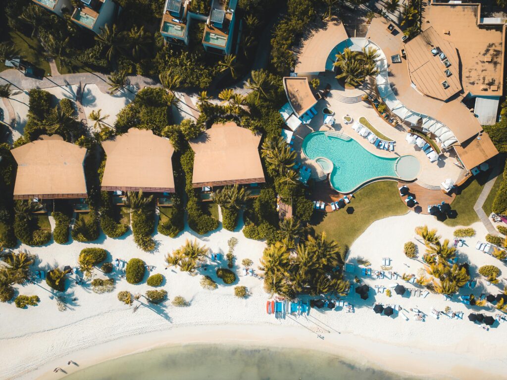 pexels-photo-16116486-16116486 Explore a luxury tropical resort in Playa del Carmen with stunning views of the beach and swimming pool.
