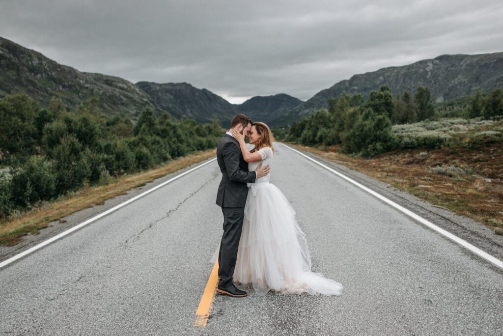 pexels-photo-7178958 A Newlywed Couple Kissing on the Road
